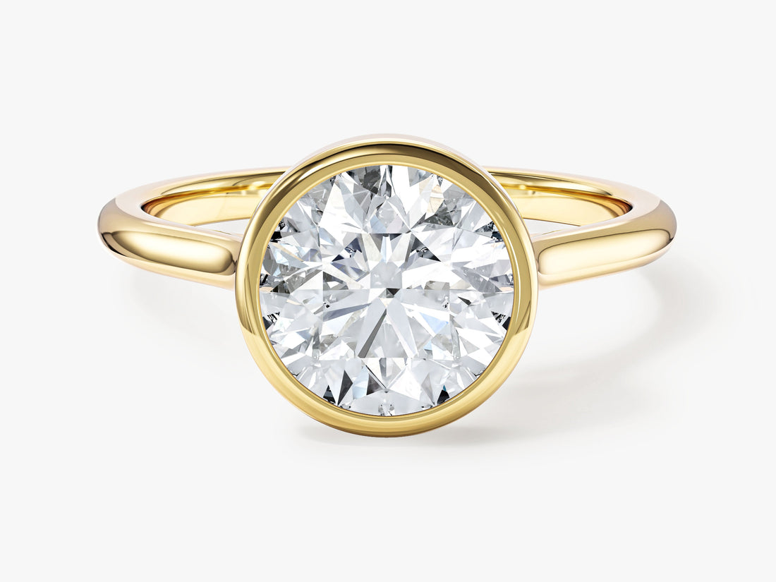 Round brilliant moissanite full bezel solitaire engagement ring in yellow gold, front view