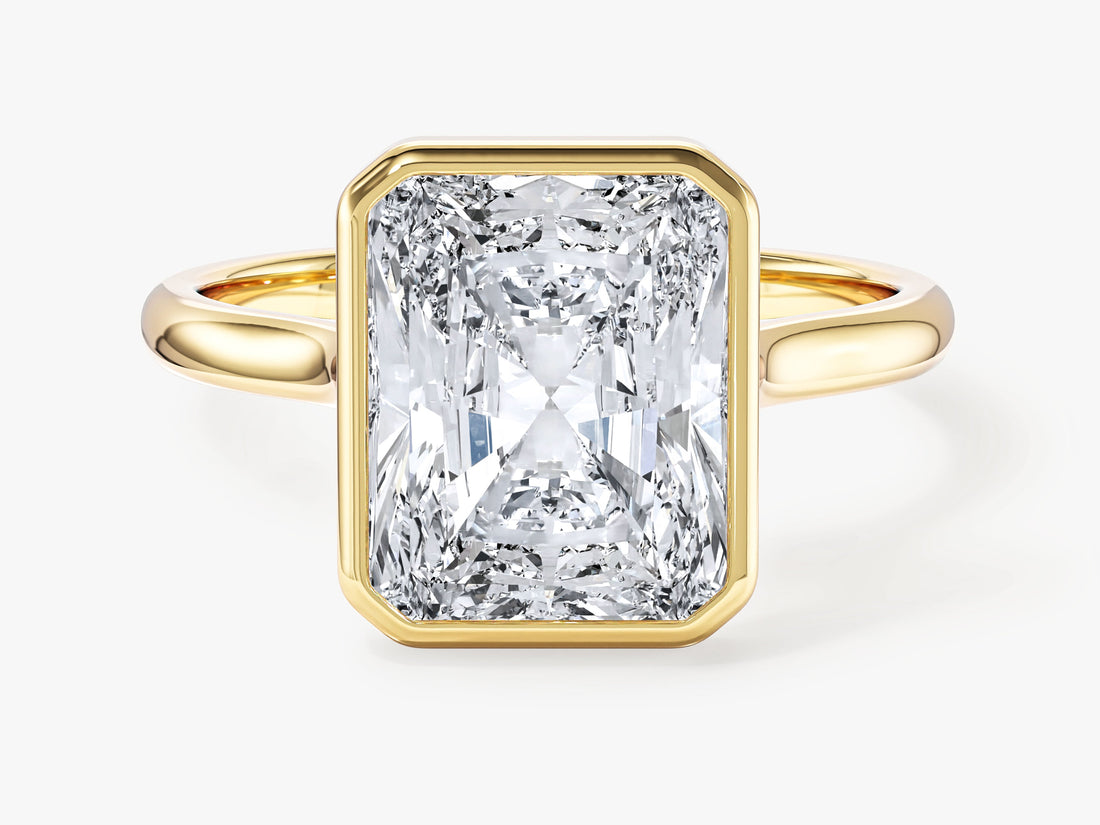 Large radiant lab grown diamond bezel statement engagement ring in yellow gold, front view