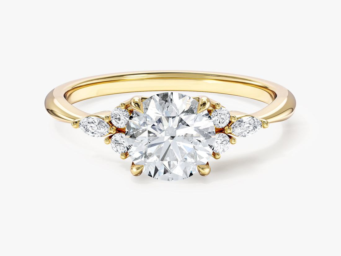 Round cut moissanite cluster accent engagement ring with marquise side stones in 14K yellow gold, front view