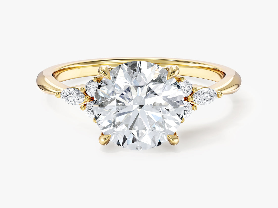 Round brilliant moissanite engagement ring with marquise and round accent shoulders in 14K yellow gold, front view