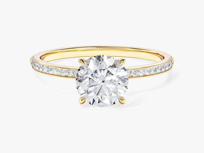 Round lab grown diamond channel set engagement ring with four prong center in yellow gold, front view