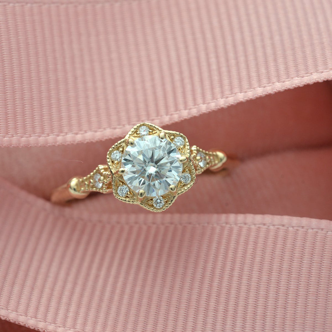 Round brilliant moissanite floral lobed vintage halo engagement ring in yellow gold