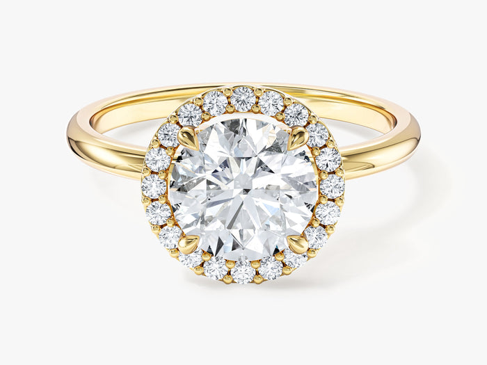 Round cut moissanite micro prong halo engagement ring with polished band in yellow gold, front view