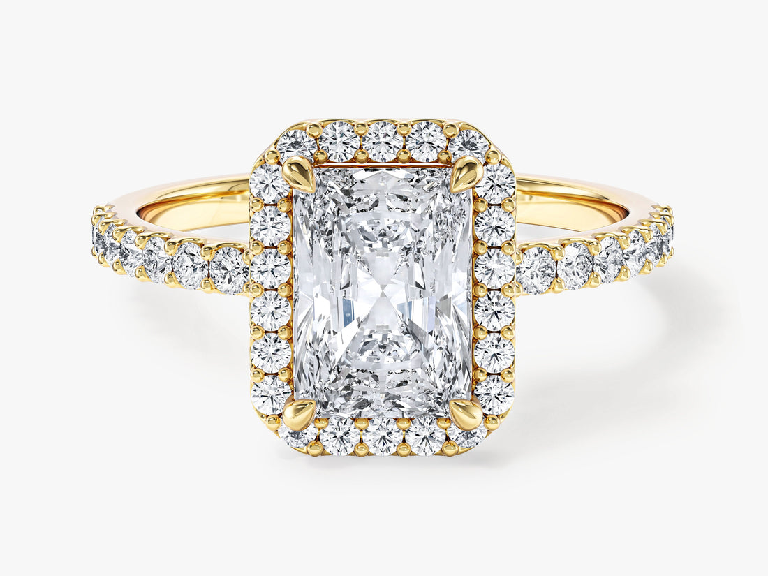 Radiant cut moissanite halo engagement ring with pave band in 14K yellow gold, front view