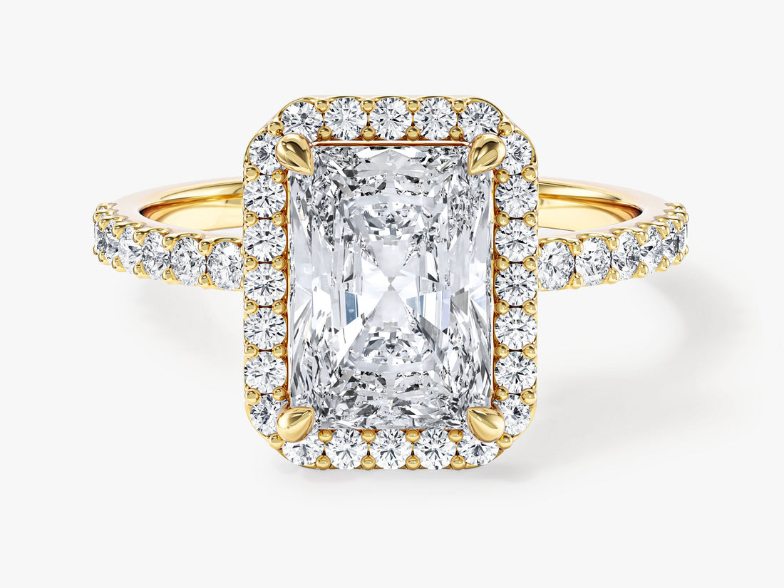 Rectangle radiant moissanite halo engagement ring with pave shoulders in 14K yellow gold, front view