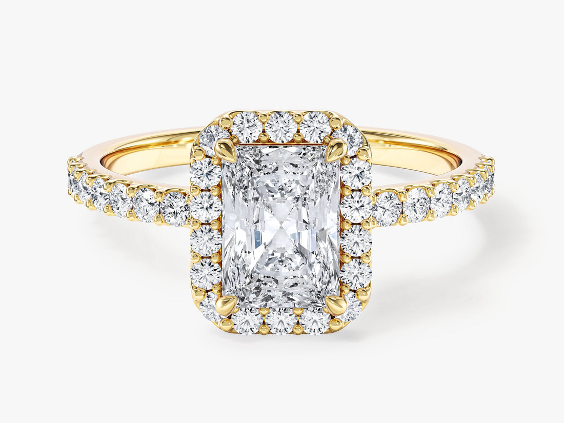 Radiant moissanite micro prong halo engagement ring with accent stone band in 14K yellow gold, front view