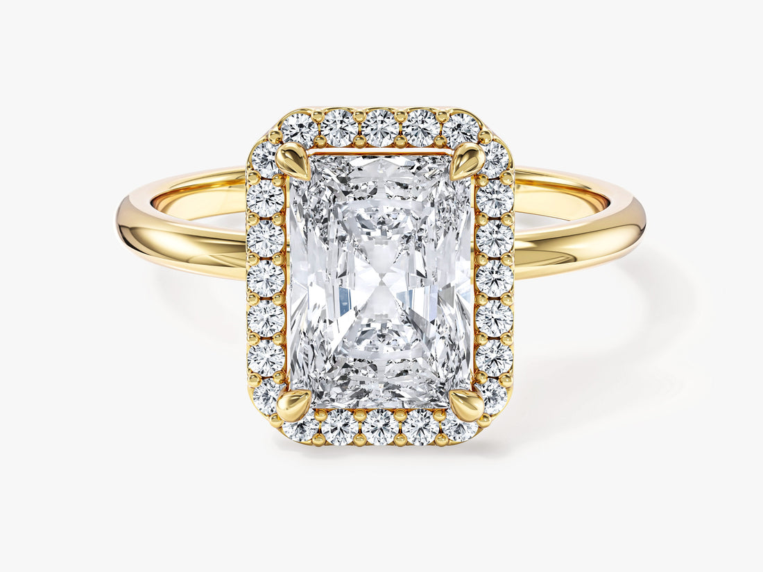 Radiant cut moissanite halo engagement ring with plain band in yellow gold, front view