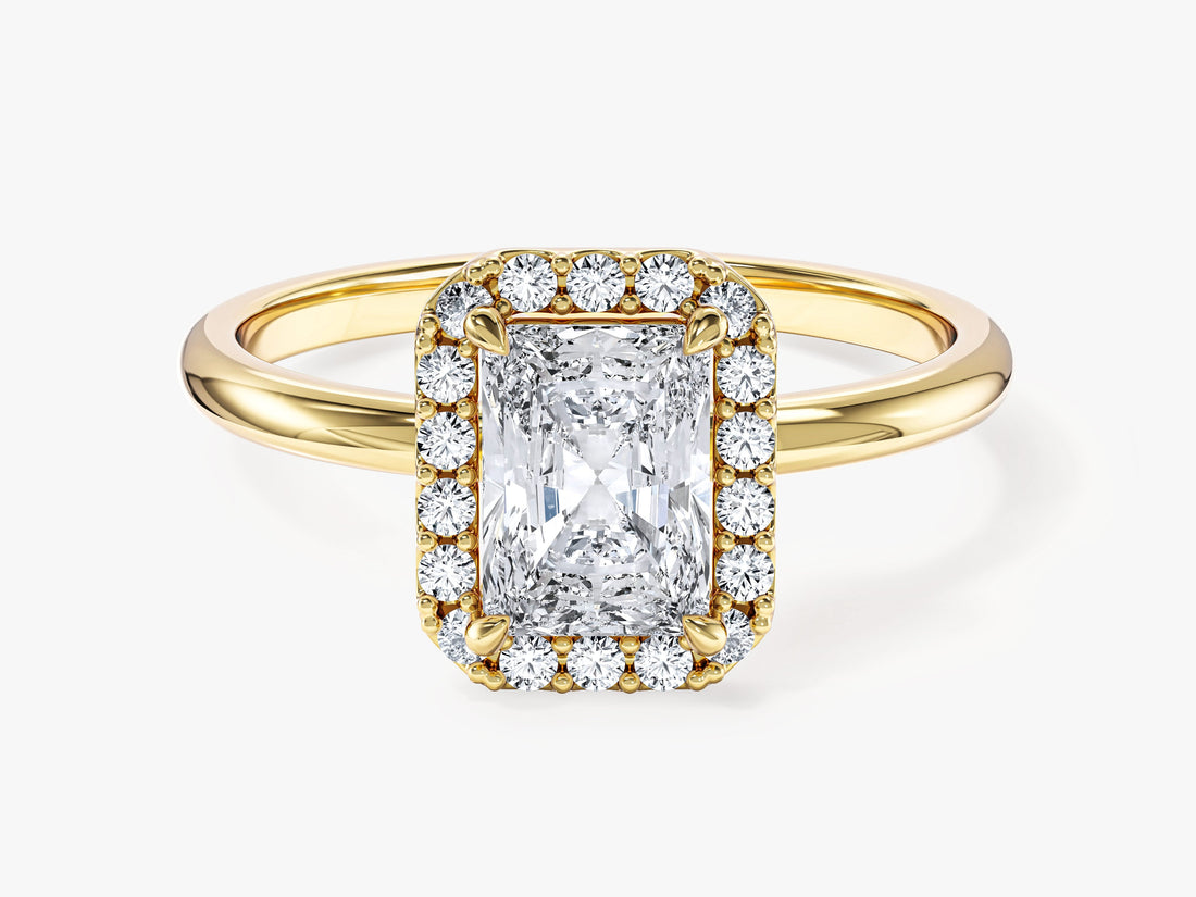 Elongated radiant lab grown diamond pave halo engagement ring with thin plain shank in yellow gold, front view