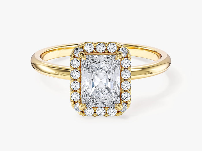 Elongated radiant lab grown diamond pave halo engagement ring with thin plain shank in yellow gold, front view
