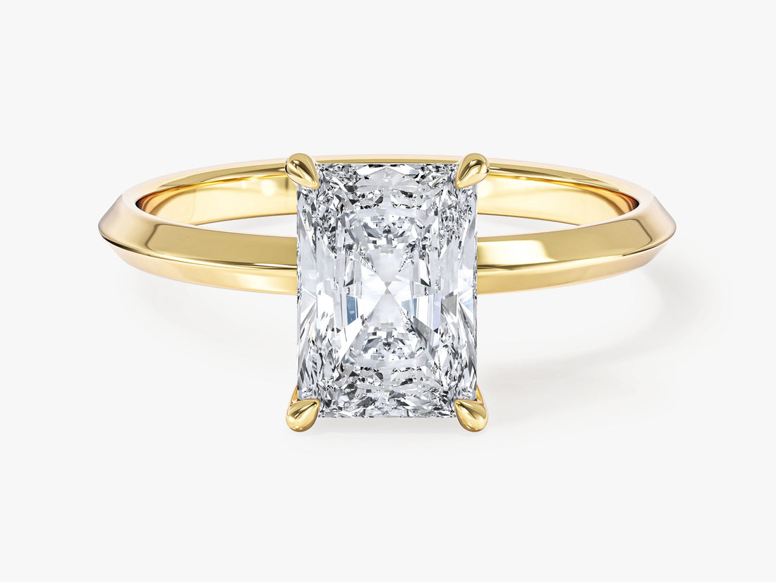 Radiant cut moissanite knife edge solitaire engagement ring in 14K yellow gold, front view