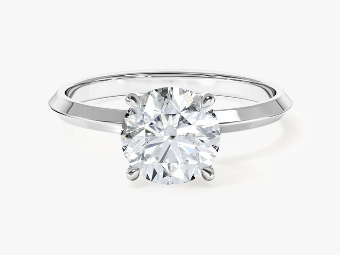 Round lab grown diamond solitaire with tapered knife edge shank in white gold, front view