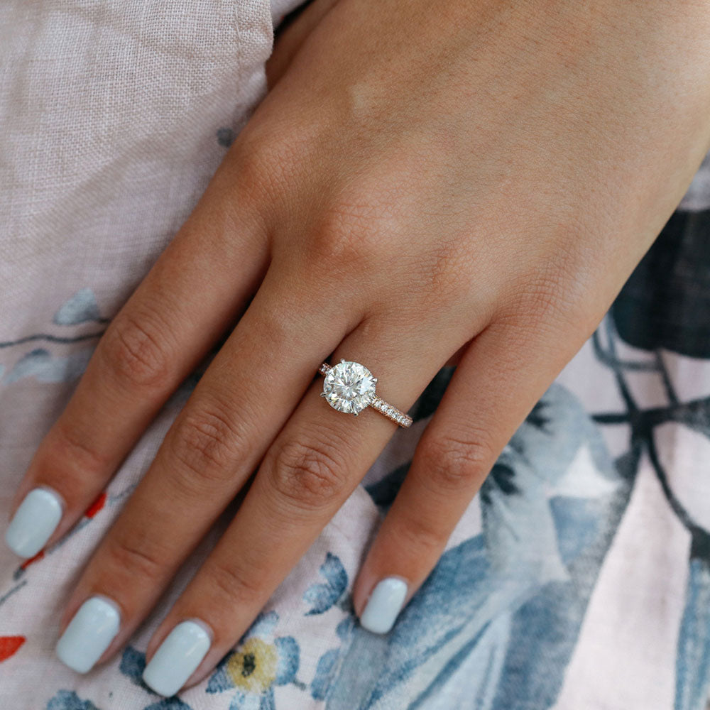 Large round brilliant moissanite engagement ring on a fine pave band in white gold