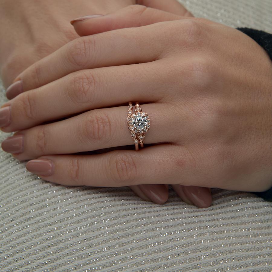 Round brilliant moissanite marquise panel flower halo engagement ring in rose gold