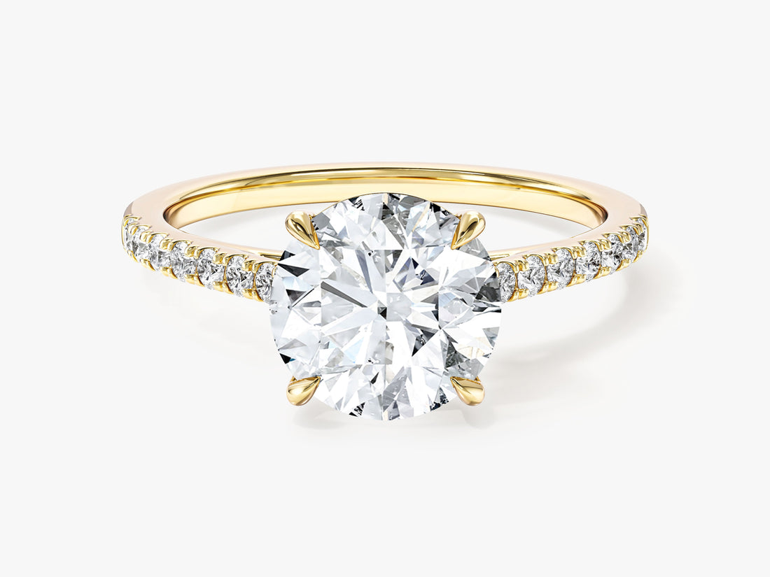 Round lab grown diamond micro pave engagement ring with four claw setting in yellow gold, front view