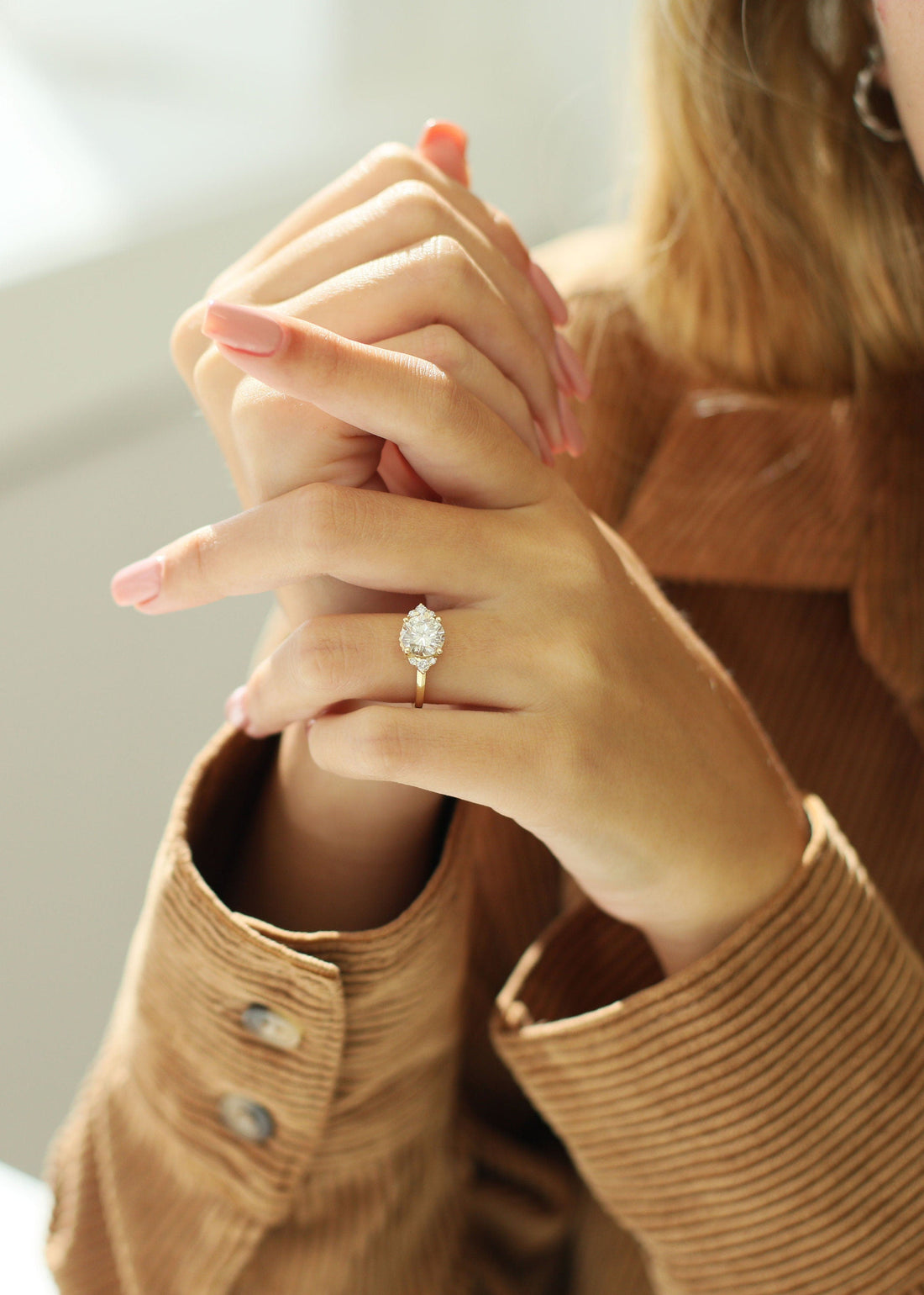 Round brilliant moissanite north south cluster engagement ring in yellow gold