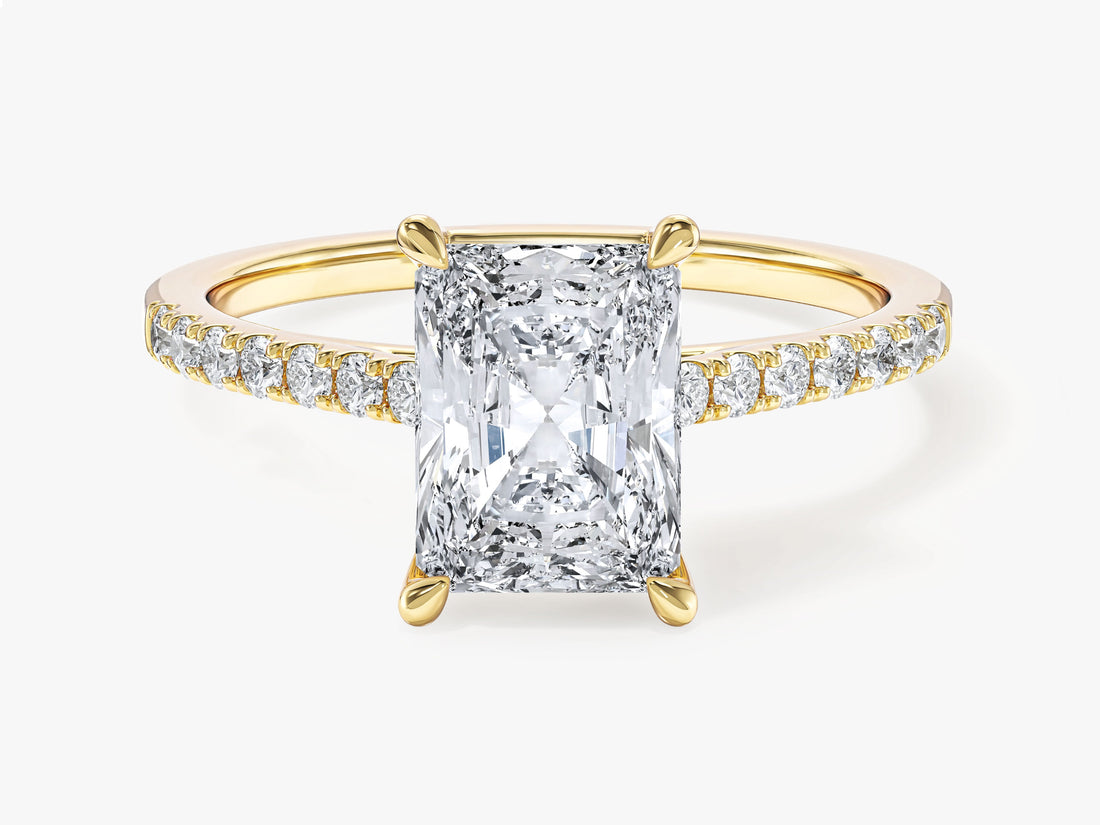 Radiant cut moissanite engagement ring with pave band in 14K yellow gold, front view