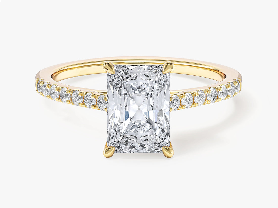 Elongated radiant moissanite pave solitaire engagement ring in 14K yellow gold, front view