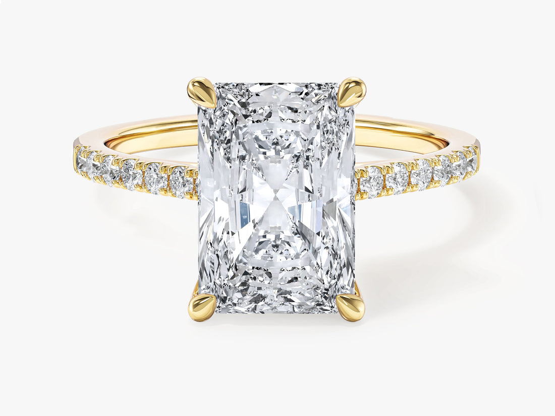 Large radiant cut moissanite four prong engagement ring with accented band in 14K yellow gold, front view