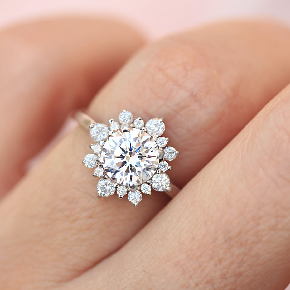 Round brilliant moissanite snowflake starburst halo engagement ring in white gold