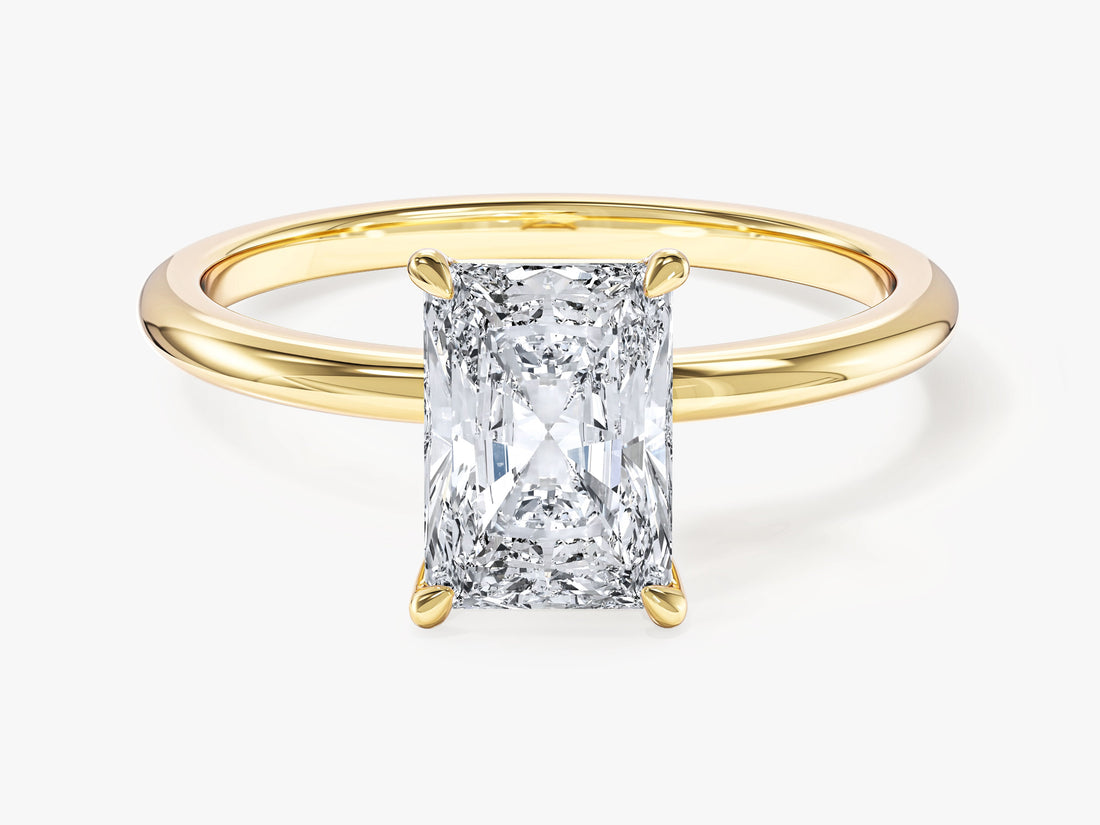 Rectangle radiant cut moissanite four prong solitaire engagement ring in yellow gold, front view