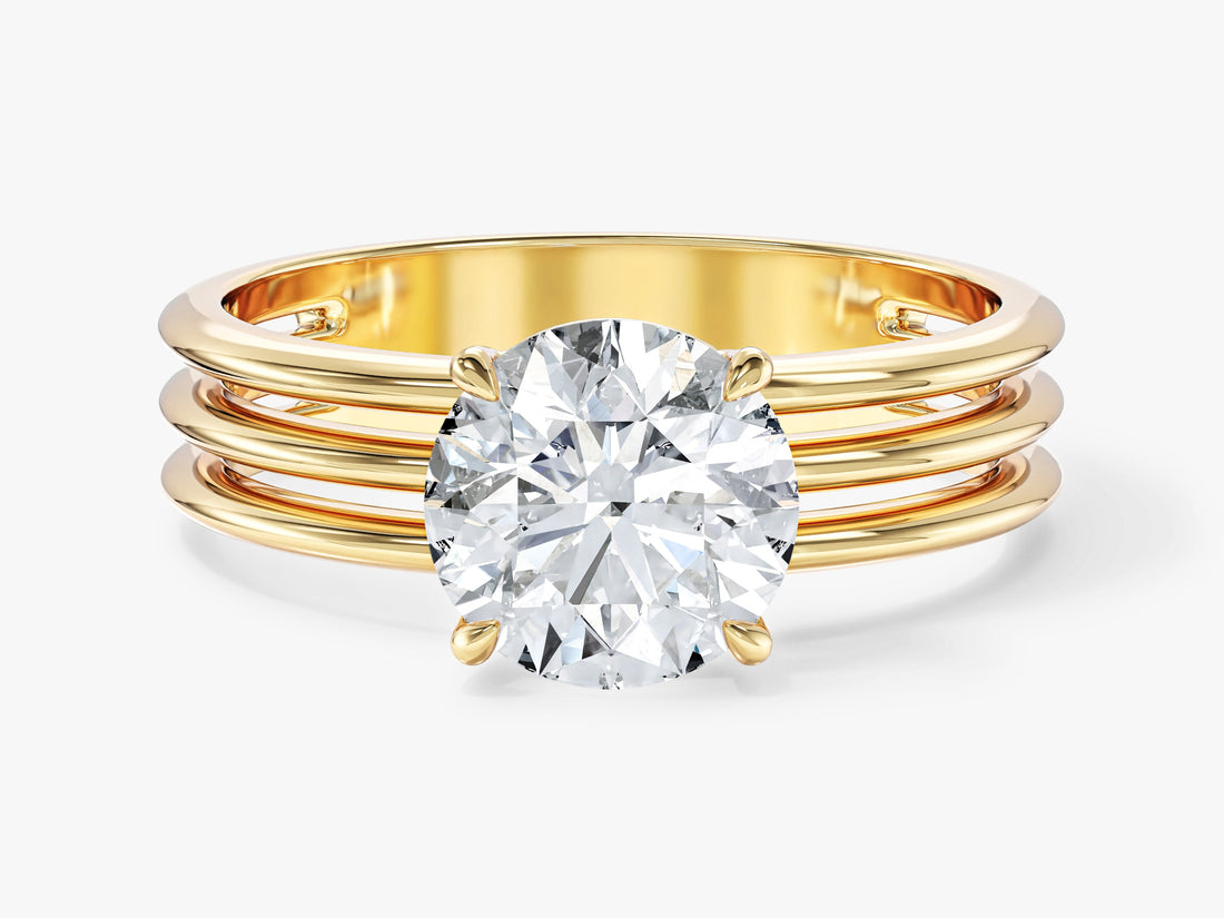 Round moissanite four prong solitaire engagement ring on triple row band in 14K yellow gold, front view