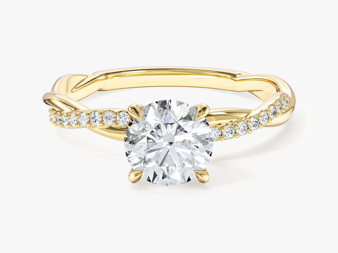Round moissanite twist engagement ring with pave band in 14K yellow gold, front view