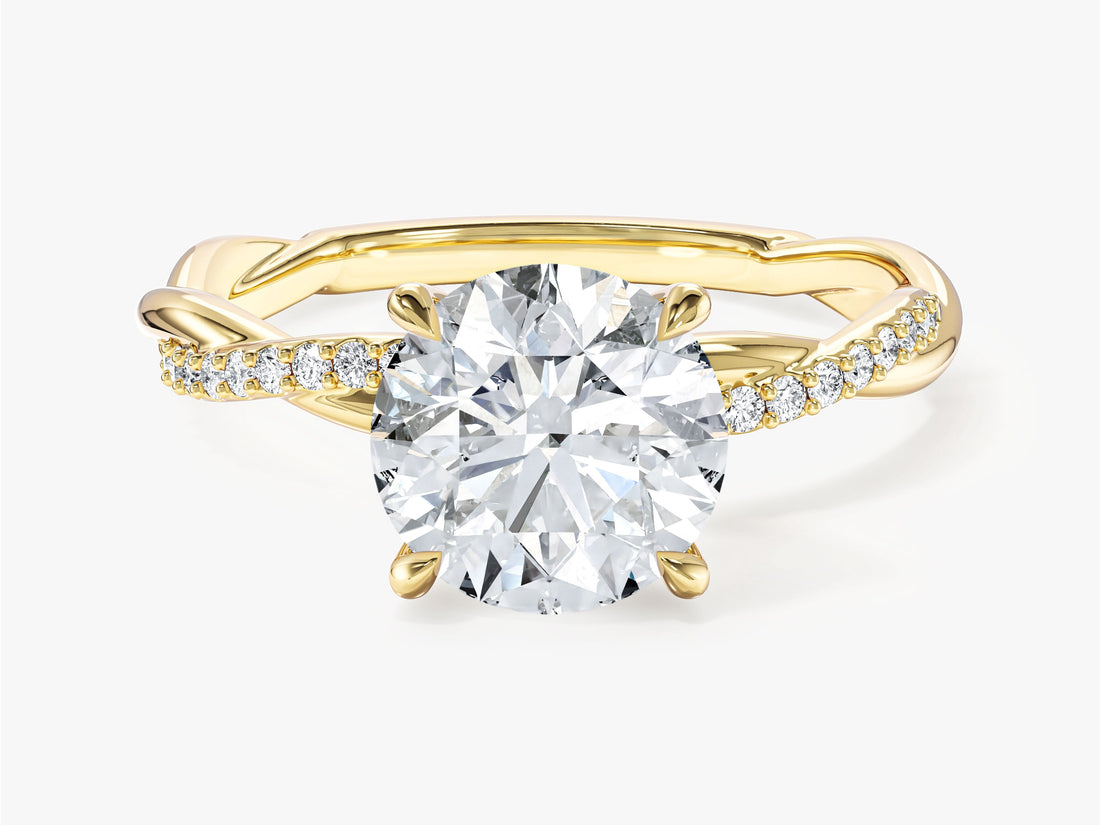 Round brilliant moissanite infinity twist engagement ring with four claw setting in 14K yellow gold, front view