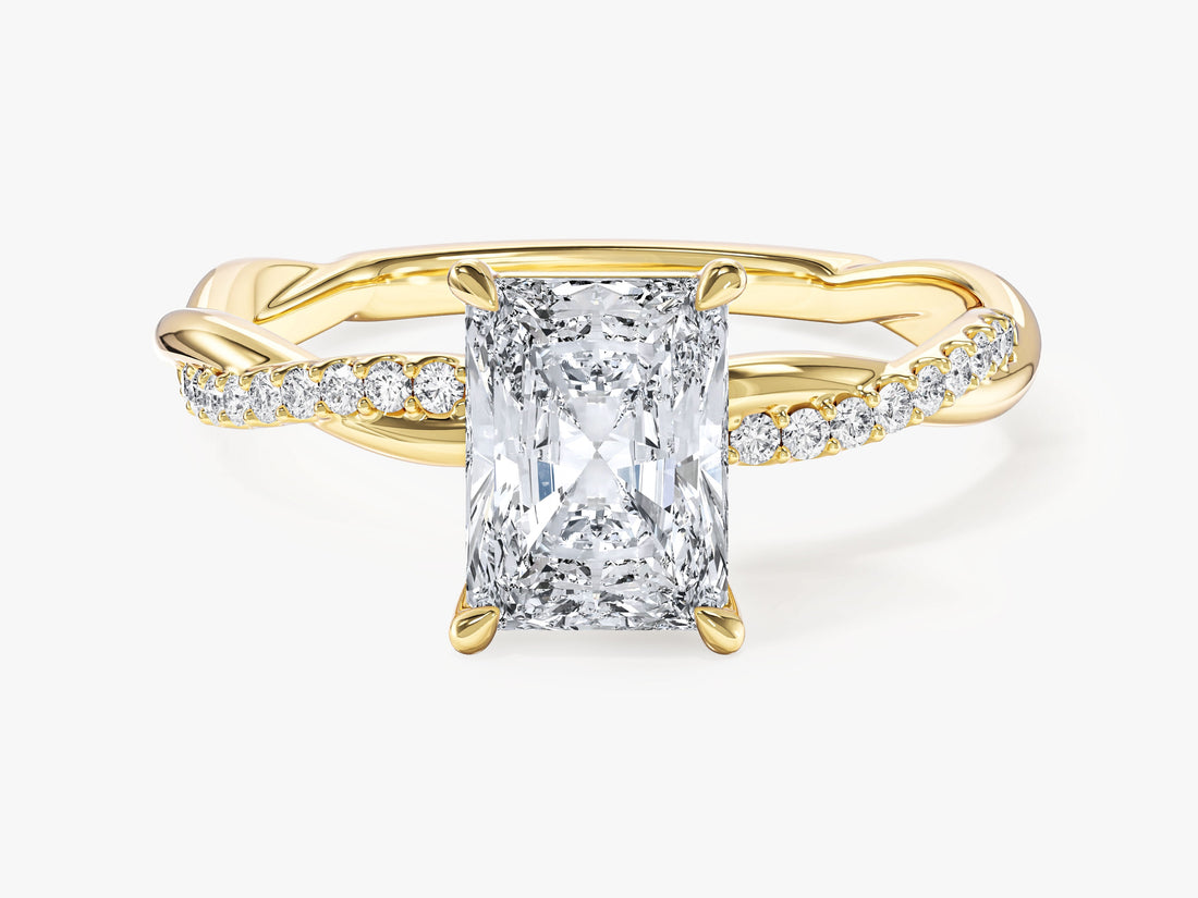 Radiant cut moissanite engagement ring with twisted pave band in 14K yellow gold, front view