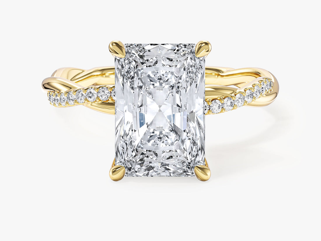 Large radiant moissanite statement engagement ring on a pave rope twist band in 14K yellow gold, front view