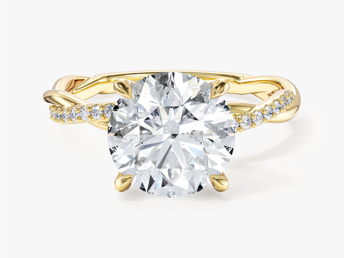 Large round moissanite engagement ring with intertwined half pave band in 14K yellow gold, front view