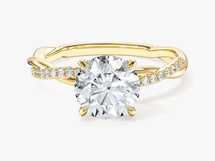 Round lab grown diamond four prong engagement ring with twisted pave band in yellow gold, front view