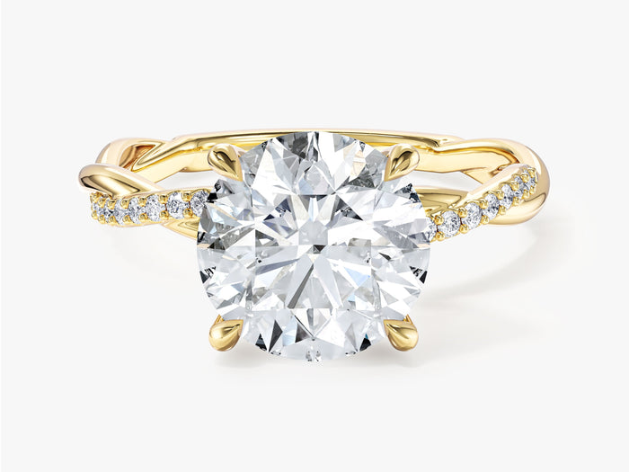 Round lab grown diamond solitaire with half pave crossover twist band in yellow gold, front view