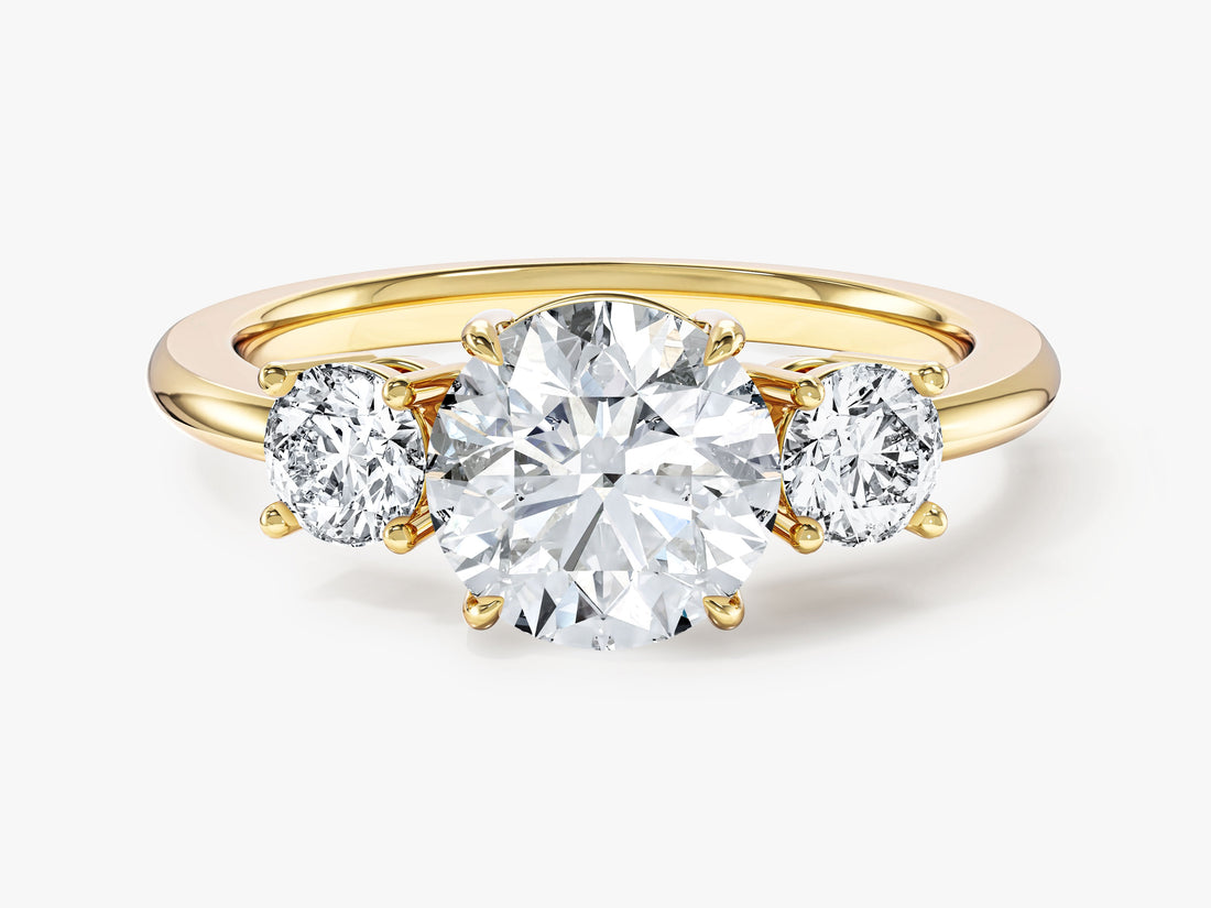 Round brilliant moissanite past present future three stone engagement ring in 14K yellow gold, front view