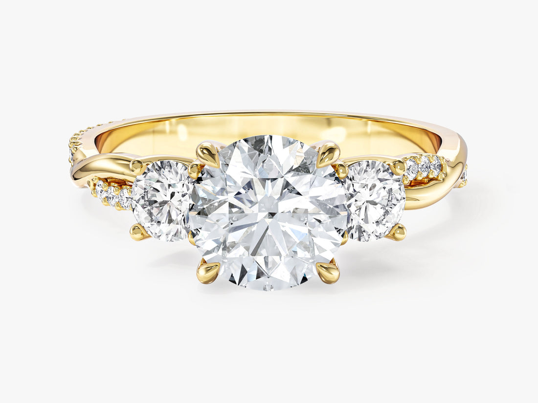 Round cut moissanite twist band three stone engagement ring with half pave in yellow gold, front view