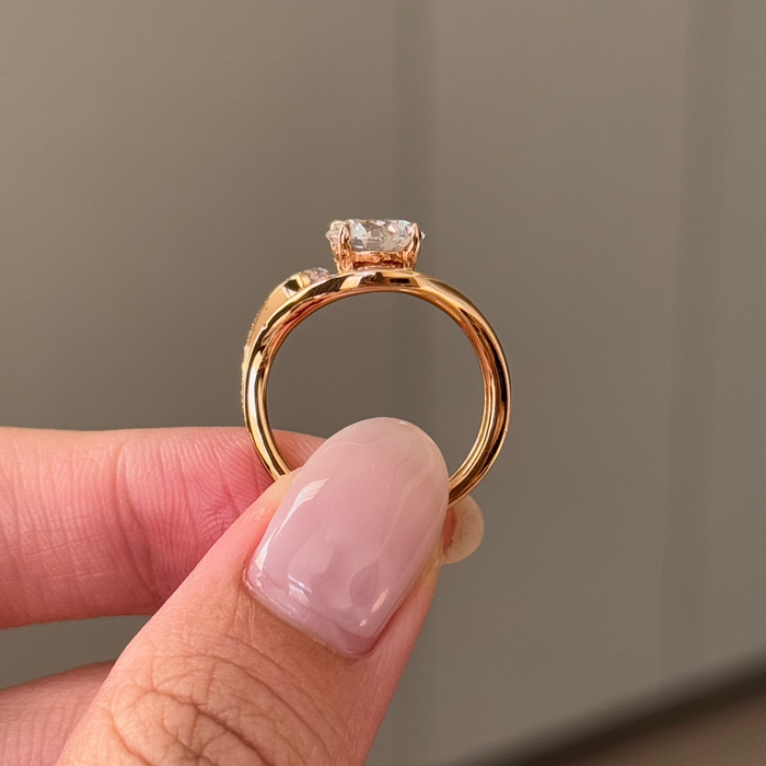 Round cut moissanite twisted pave sculptural engagement ring in rose gold, view 2