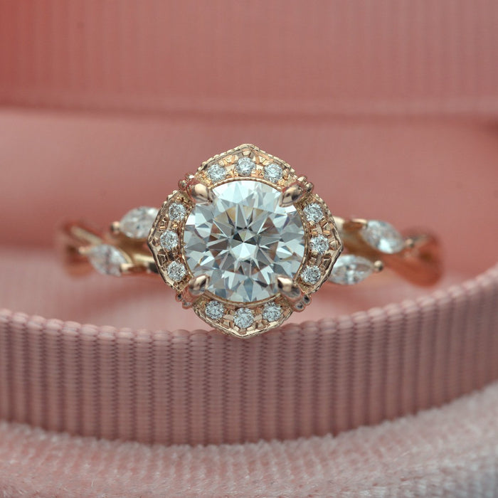 Round brilliant moissanite vintage halo engagement ring on a marquise leaf vine split shank in rose gold, view 2