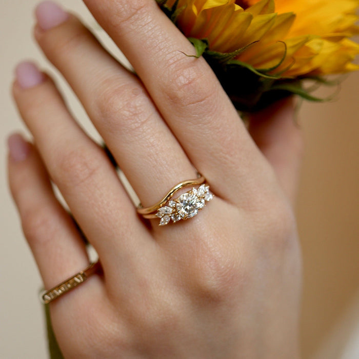 Round cut moissanite petite wing cluster engagement ring in yellow gold, view 2