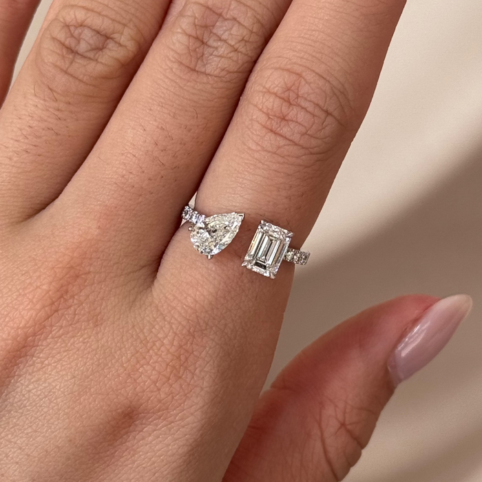 Pear and emerald cut moissanite toi et moi engagement ring with a pave band in white gold, view 2