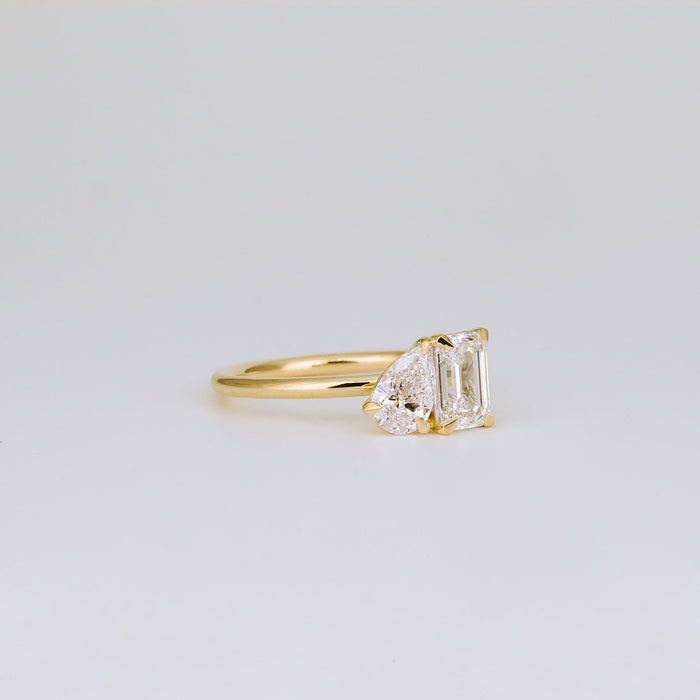 Emerald cut and half moon moissanite toi et moi engagement ring in yellow gold, view 2
