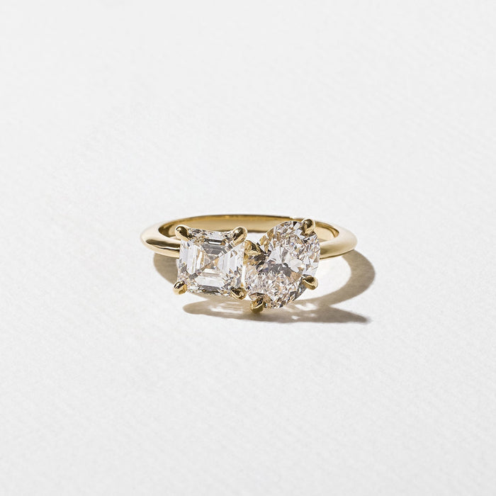 Oval and asscher cut moissanite petite toi et moi engagement ring in yellow gold