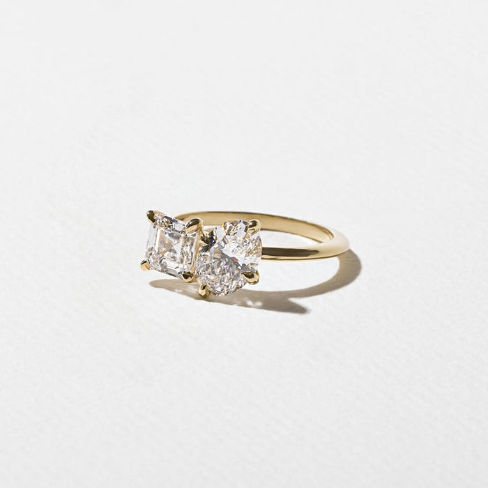Oval and asscher cut moissanite petite toi et moi engagement ring in yellow gold, view 2