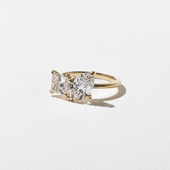Pear and princess cut moissanite petite toi et moi engagement ring in yellow gold, view 2