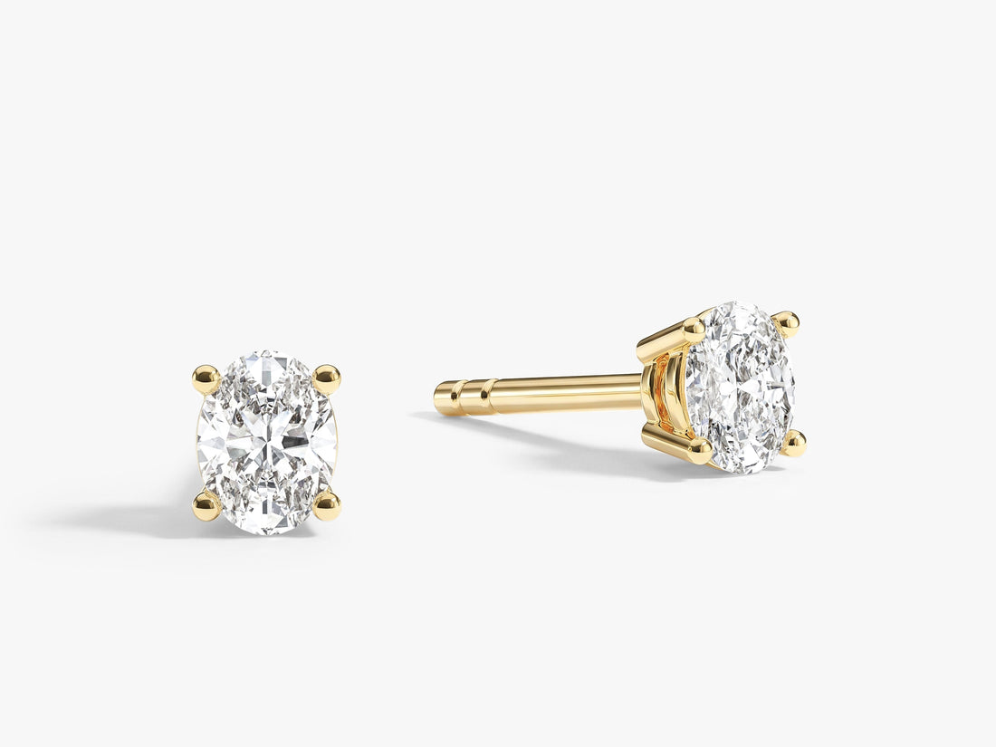 Pair of oval everyday 4 prong solitaire lab grown diamond stud earrings in yellow gold, E color VVS2 lab grown diamonds
