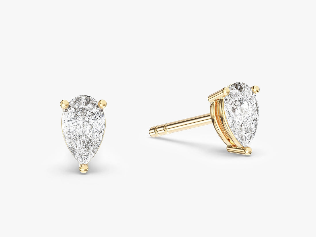 Pair of pear everyday 3 prong solitaire lab grown diamond stud earrings in yellow gold, E color VVS2 lab grown diamonds