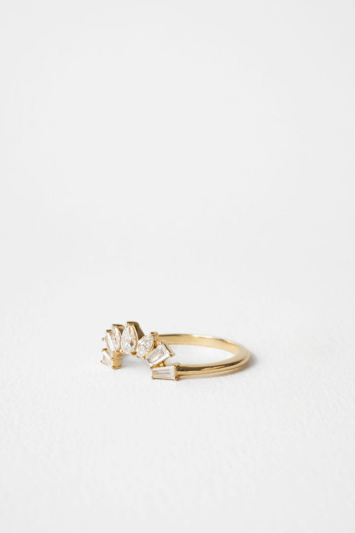 Curved fan moissanite wedding band in yellow gold, side view