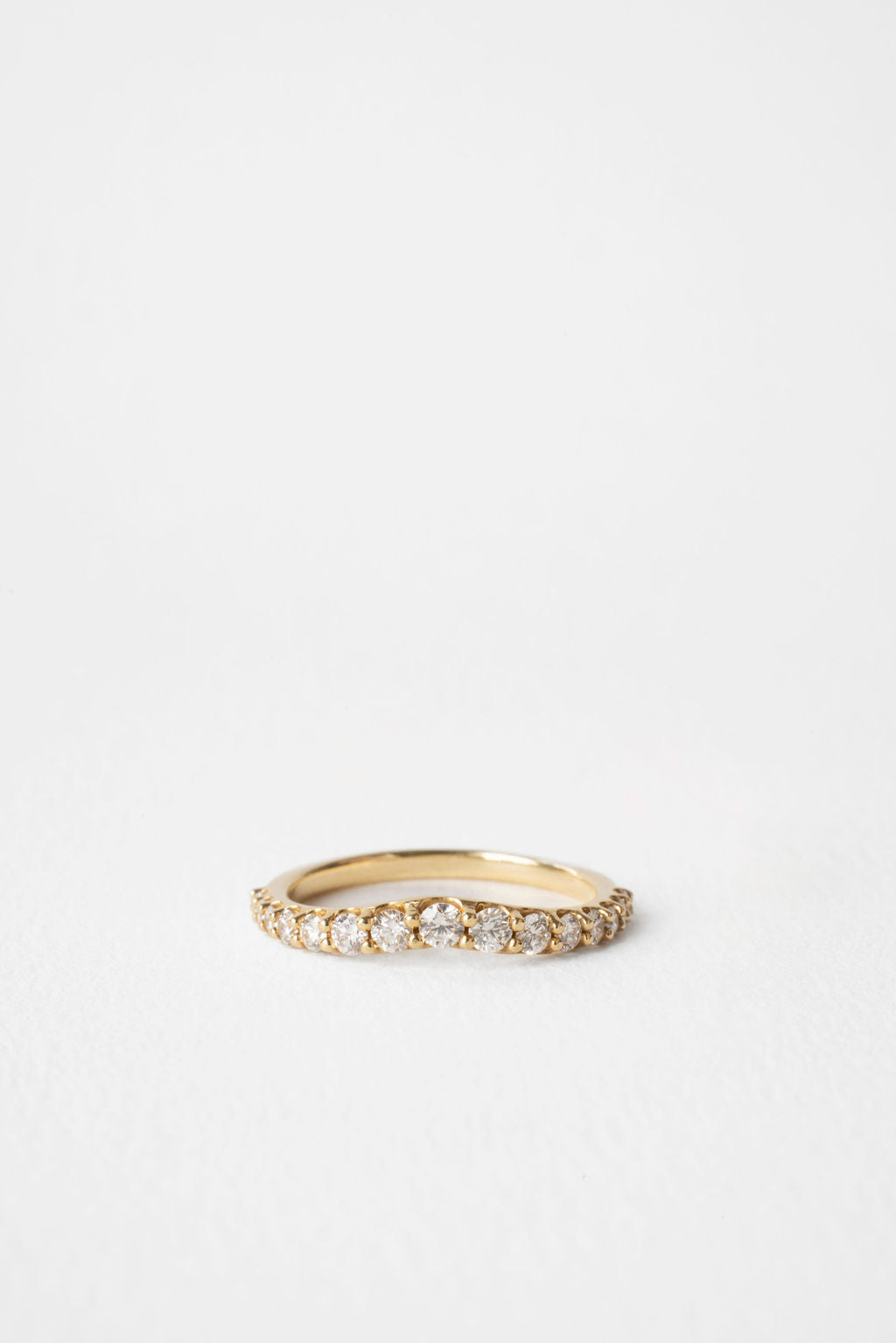 Round lab grown diamond curved wedding band 0.55 CT TW in yellow gold, front view
