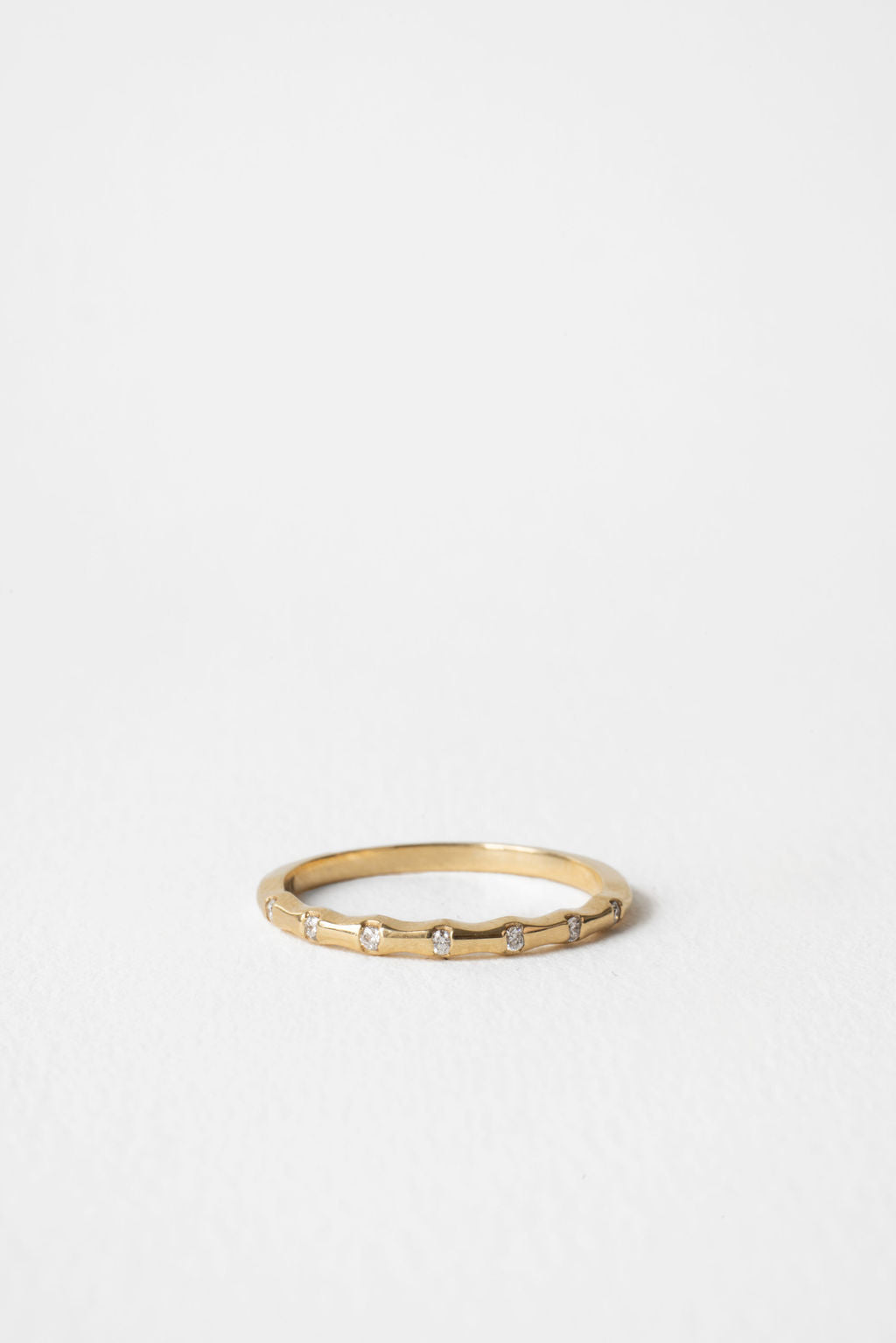 Round lab grown diamond dainty wedding band 0.06 CT TW in yellow gold, front view