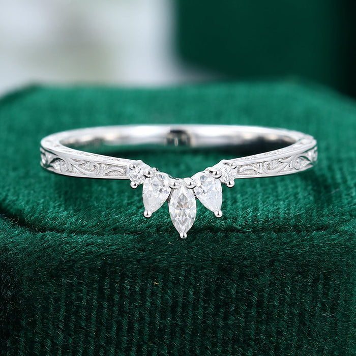 Round, Marquise and Pear moissanite engraved scroll crown curved wedding band, front view in white gold