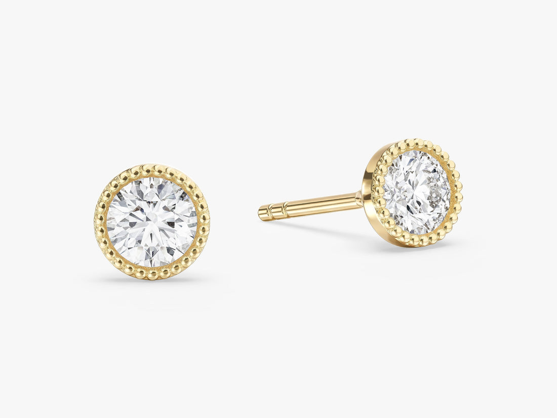 Pair of round milgrain bezel solitaire lab grown diamond stud earrings in yellow gold, E color VVS2 lab grown diamonds