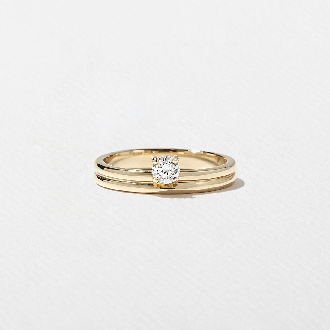 Round lab grown diamond single stone wedding band in yellow gold front view
